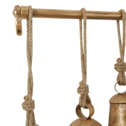 Kirkland's Home Decorative Accents-Aged Triangle Bells Wall Plaque