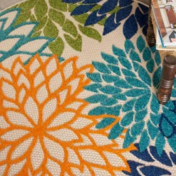 Kirkland's Home Outdoor Rugs-Tangerine Floral Burst Round Outdoor Area Rug